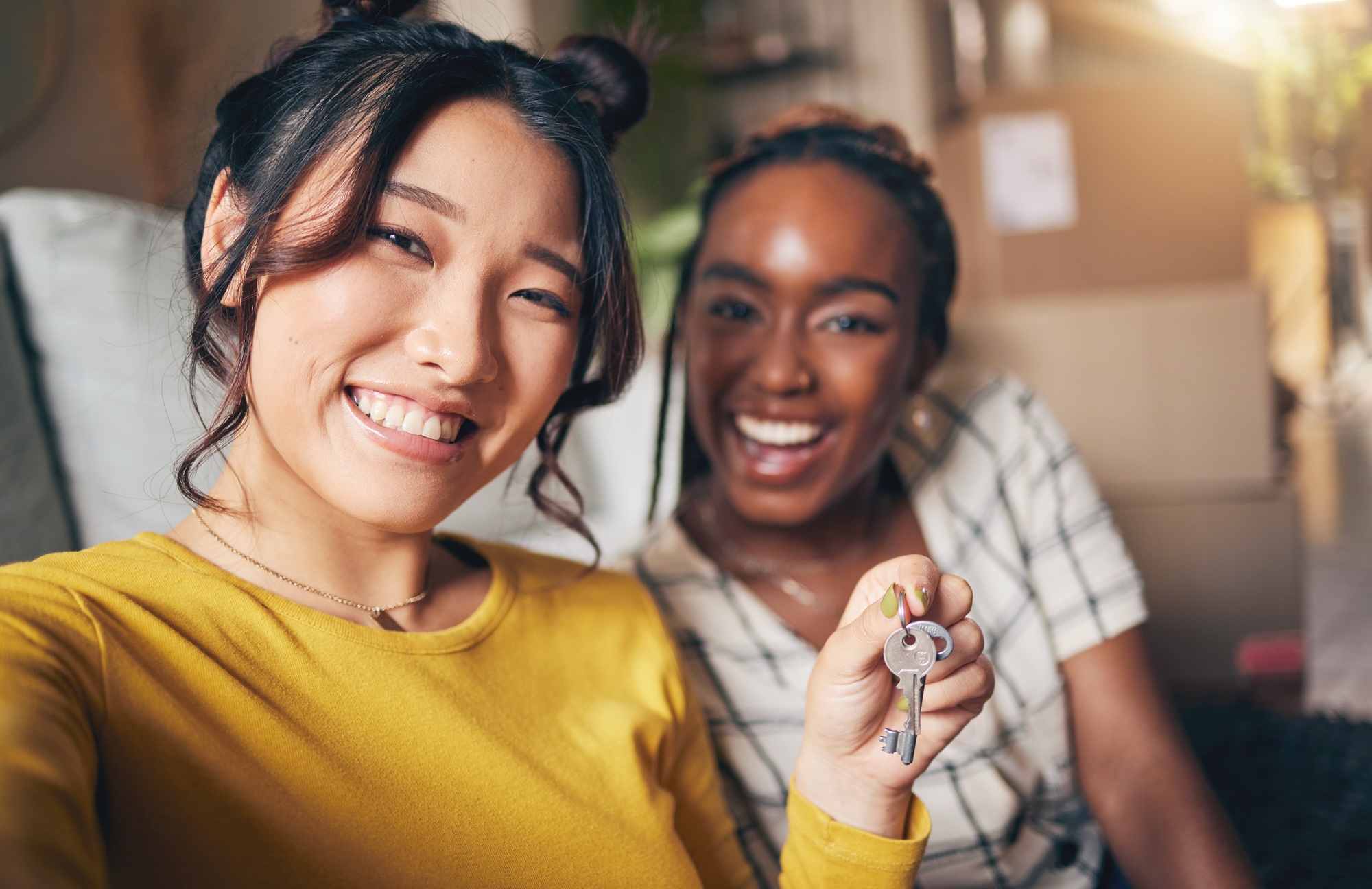 Couple of friends, keys and new home selfie for moving in together for real estate investment. Rent